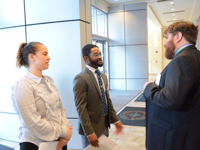 Law students talking with mentor