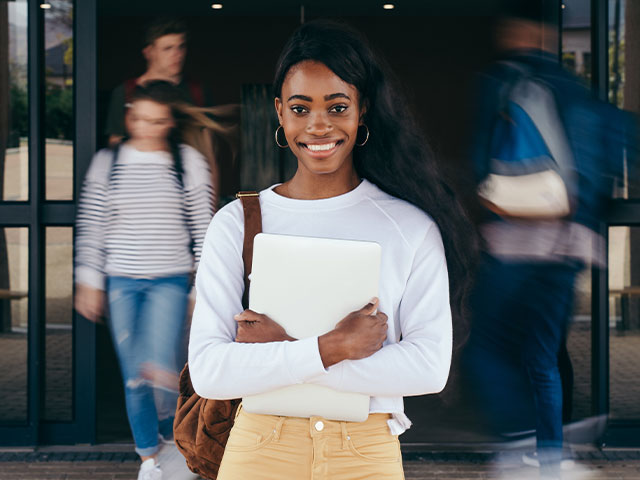 New student standing outside classroom building